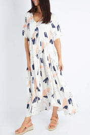 Model Gemma wearing the S/S Peak Maxi Dress in colour Peachbree (Blue), from the front, cropped image