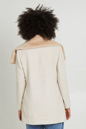 Model Olivia wearing size 10 of the Fur Trim Zip Jacket in colour Oat (White), from the back
