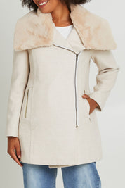 Model Olivia wearing size 10 of the Fur Trim Zip Jacket in colour Oat (White), from the front, cropped image