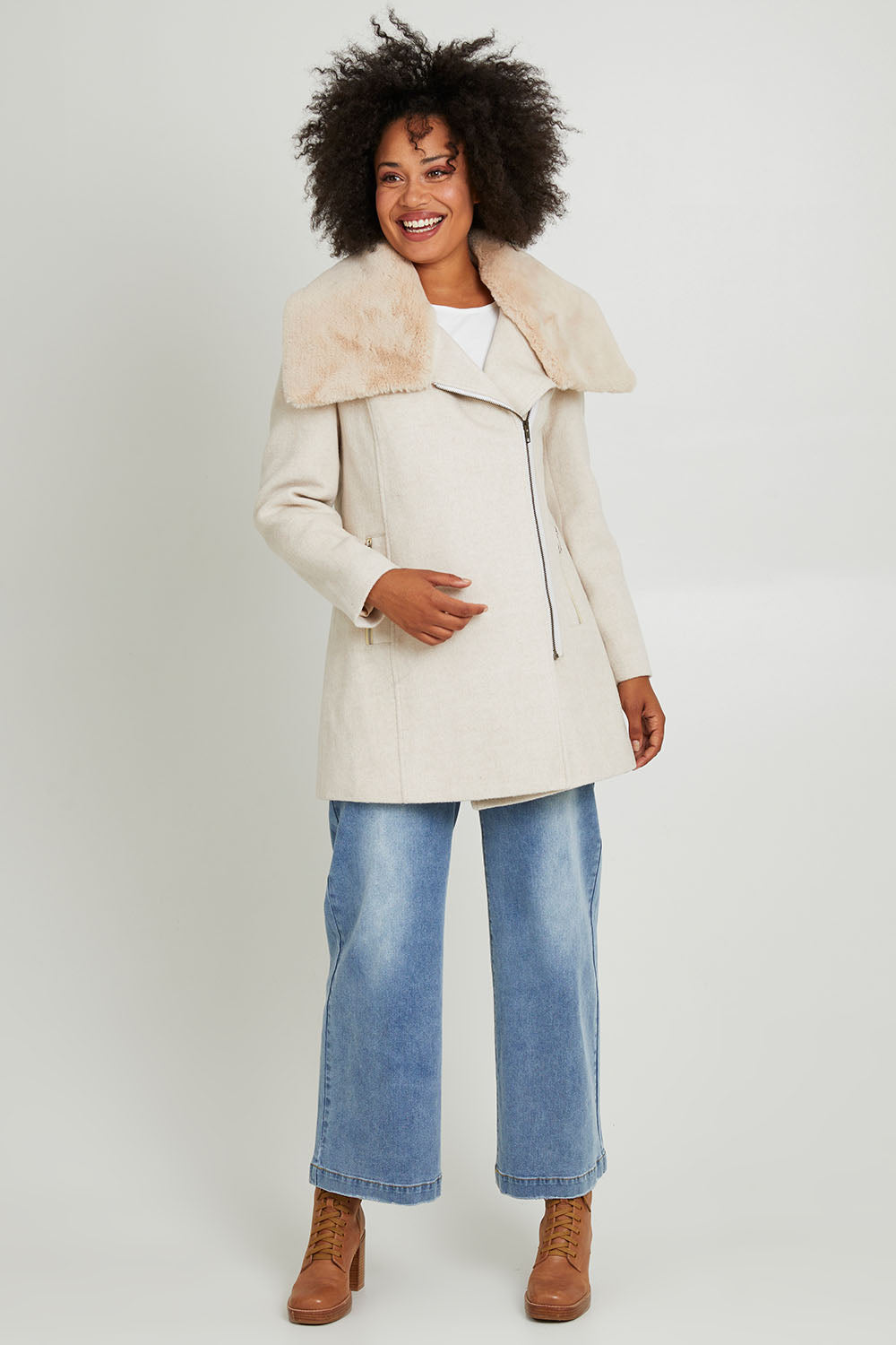 Model Olivia wearing size 10 of the Fur Trim Zip Jacket in colour Oat (White), from the front, showing the whole outfit