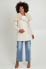 Model Olivia wearing size 10 of the Fur Trim Zip Jacket in colour Oat (White), from the front, showing the whole outfit