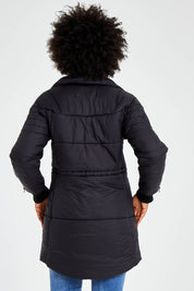 Model Olivia wearing size 10 of the Long Line Funnel Neck Puffer in colour Black (Black), from the back