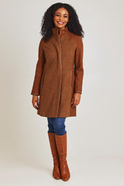 Model Ziara wearing size 10 of the Multi Fabric Jacket in colour Latte, from the front, showing the whole outfit