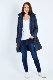 Model Andrea wearing size 10 of the Footy Jacket in colour Navy (Blue), from the front, showing the whole outfit