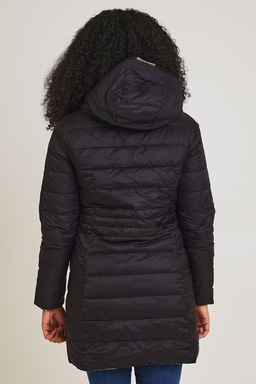 Model Ziara wearing size 10 of the 3/4 Reversible Down Jacket in colour Minkblk (Black), from the back