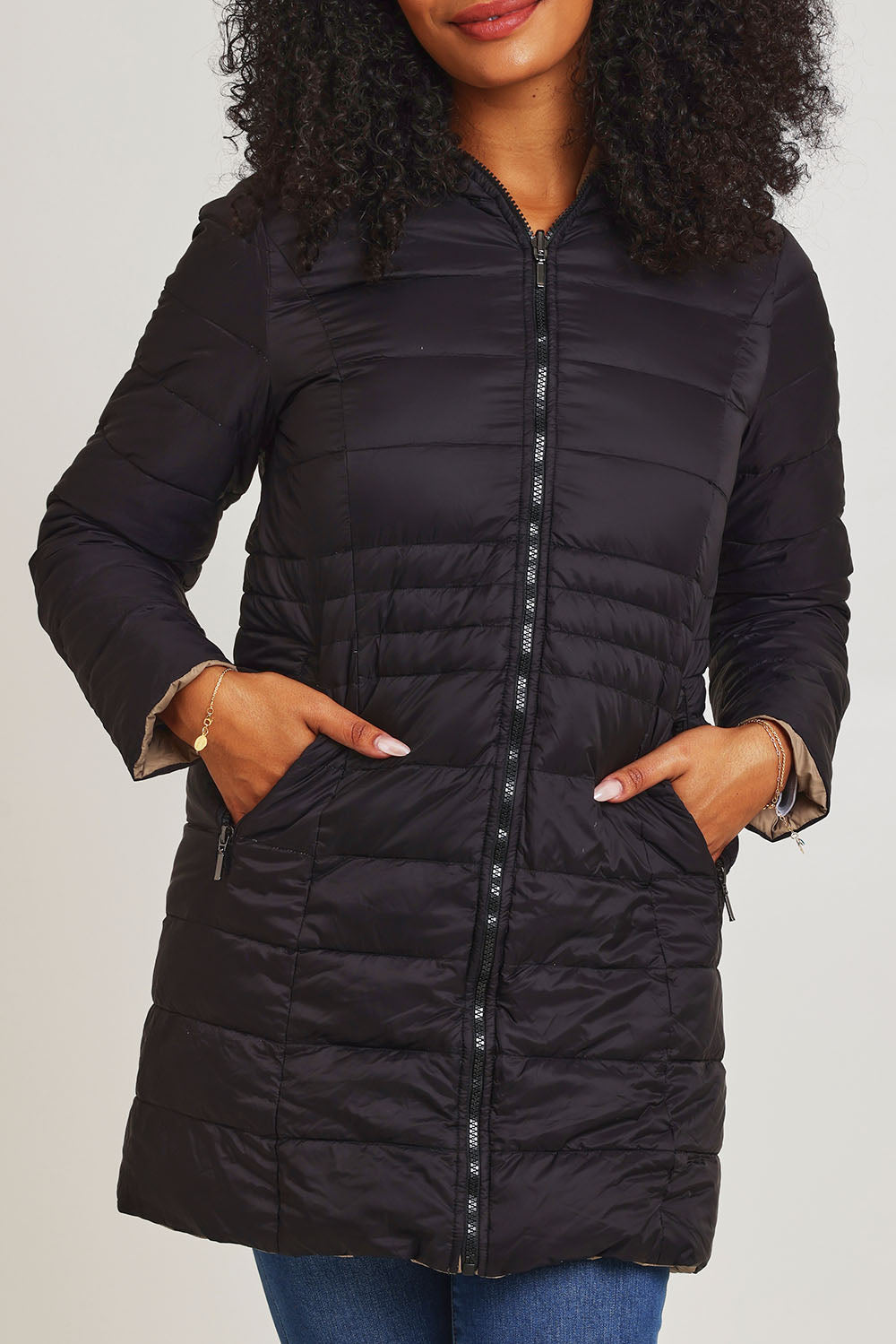 Model Ziara wearing size 10 of the 3/4 Reversible Down Jacket in colour Minkblk (Black), from the front, cropped image