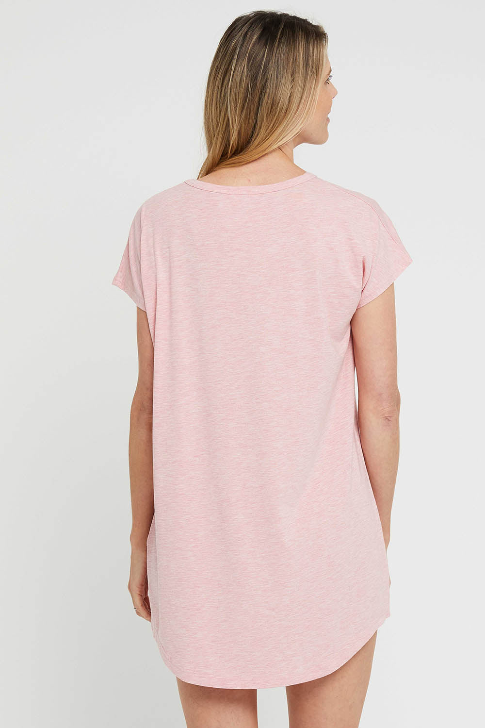 A model wearing the Bamboo Nightie in colour Rose (Pink), from the back