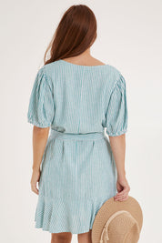 Model Sally wearing size 10 of the Birdie Dress in colour Tealstripe (Green), from the back