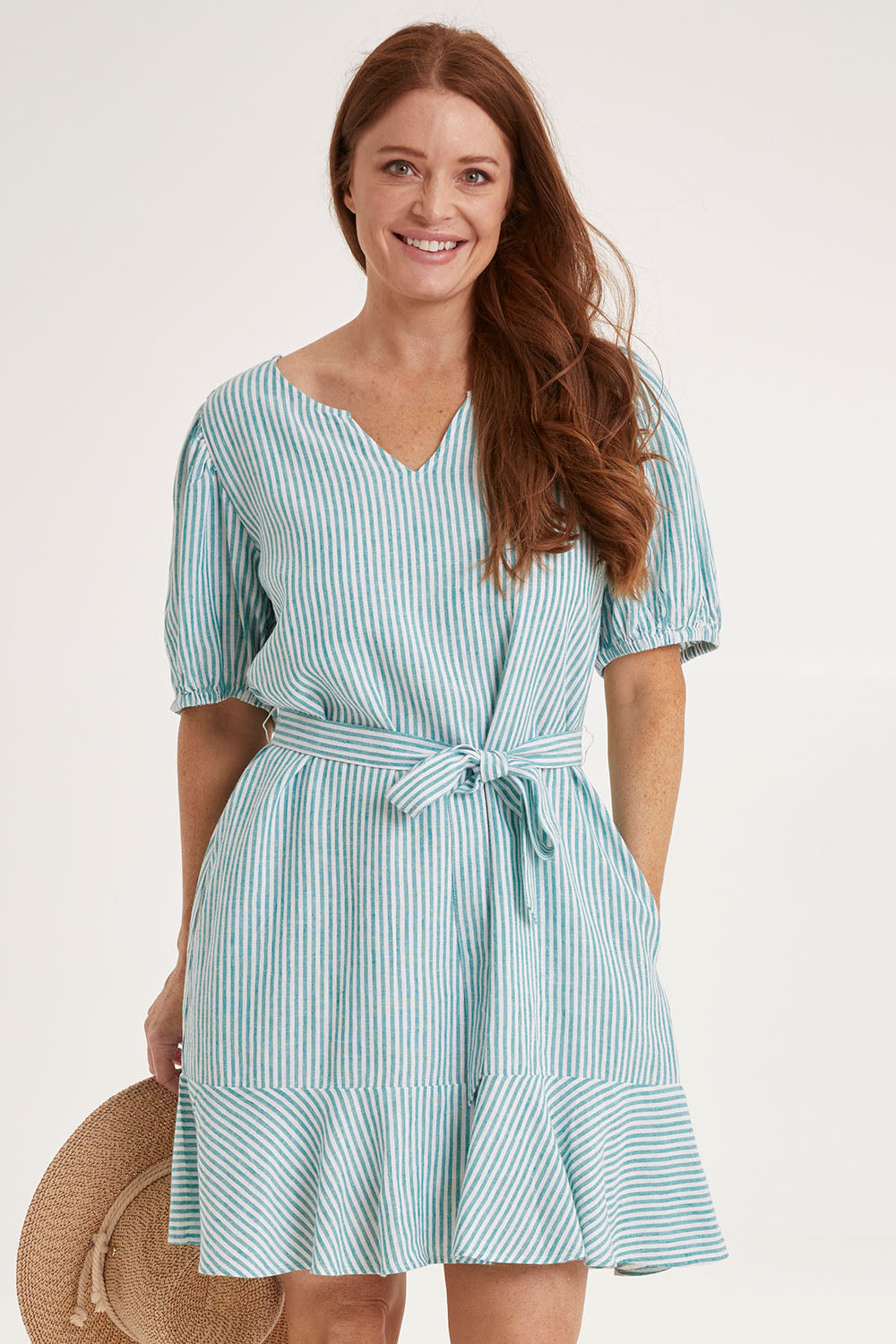 Model Sally wearing size 10 of the Birdie Dress in colour Tealstripe (Green), from the front, cropped image