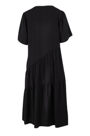 Product shot of the Florence Tiered Dress in colour Black (Black), from the back