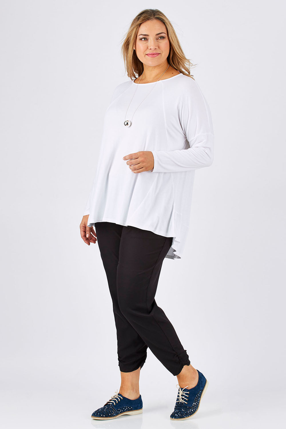 Model Ljubenka wearing size 18 of The Best Seller Pant in colour JetBlack (Black), from the front, showing the whole outfit