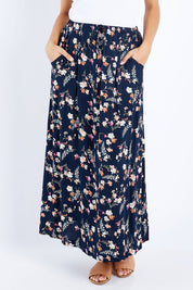 Model Lala wearing size 10 of The Drawstring Maxi Skirt in colour Fleur (Black), from the front, cropped image