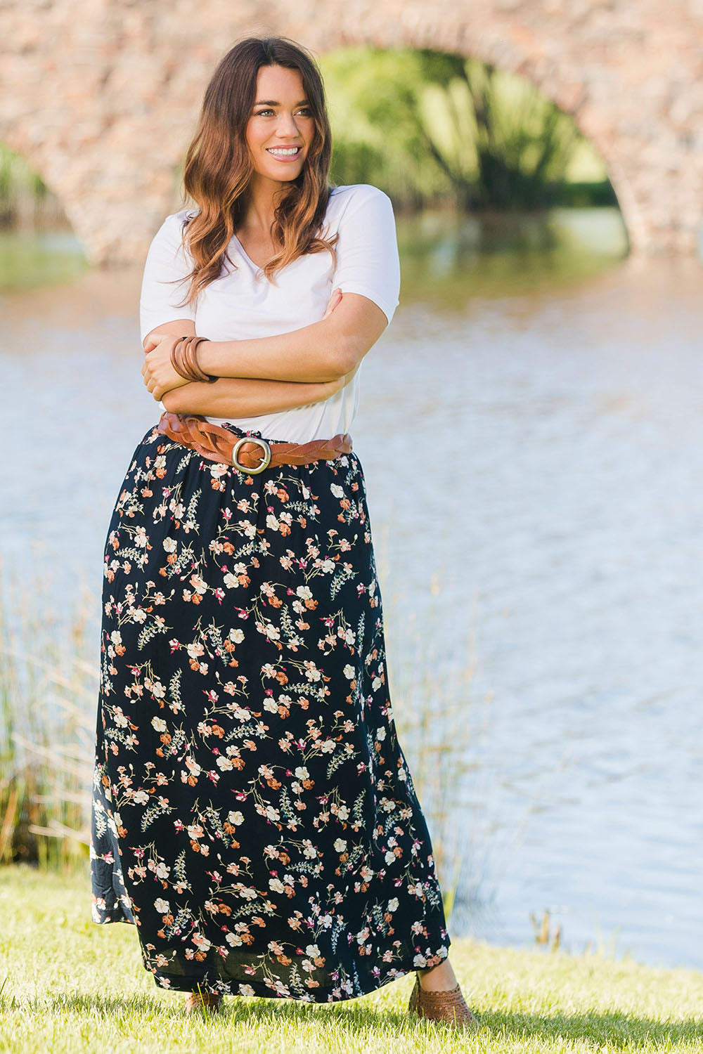 Model Laura wearing size 14 of The Drawstring Maxi Skirt in colour Fleur (Black), from the front, showing the whole outfit