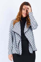 Model Laura wearing size 14 of The Free Fall Midi Cardi in colour Greyspot (Grey), from the front, cropped image