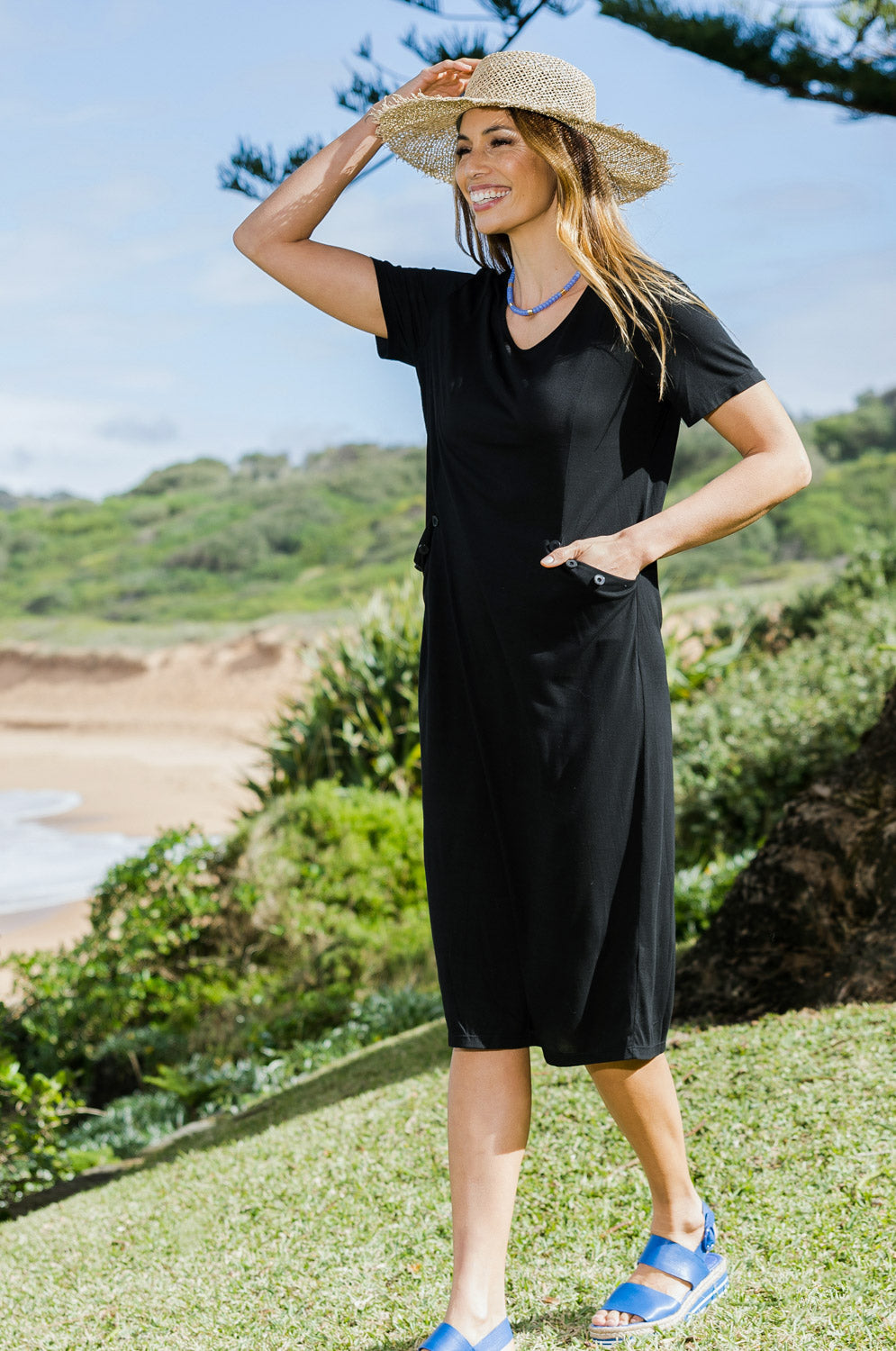 Model Amanda wearing size 10 of The Bamboo Blend Button Dress in colour Black (Black), from the front, showing the whole outfit