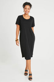 Model Noli wearing size 14 of The Bamboo Blend Button Dress in colour Black (Black), from the front, showing the whole outfit