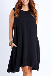 Model Laura wearing size 14 of The Essential Shift Dress in colour Black (Black), from the front, cropped image