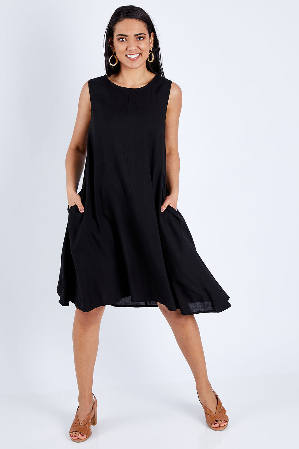 Model Pamela wearing size 10 of The Essential Shift Dress in colour Black (Black), from the front, showing the whole outfit