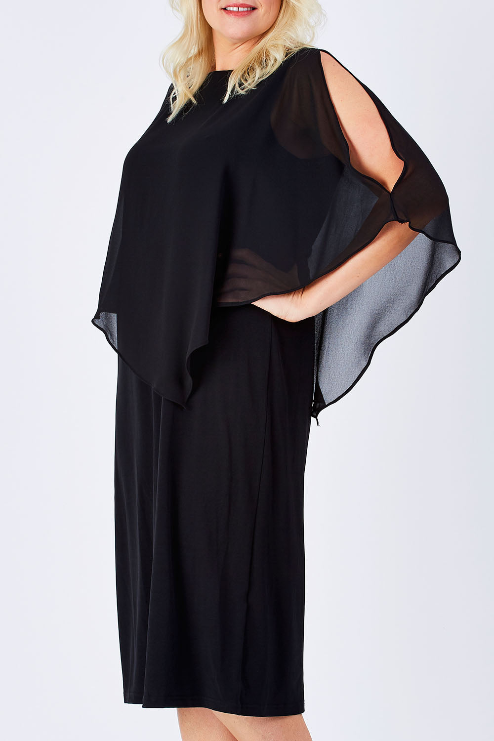 Model Natalie wearing size 16 of The Overlay Midi Dress in colour Black (Black), from the front, cropped image