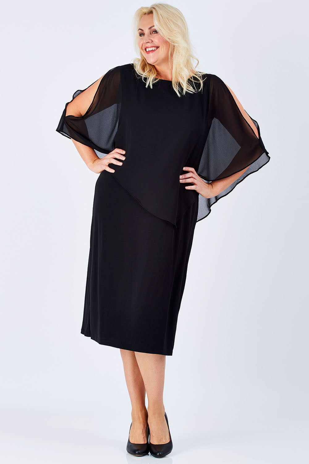 Model Natalie wearing size 16 of The Overlay Midi Dress in colour Black (Black), from the front, showing the whole outfit
