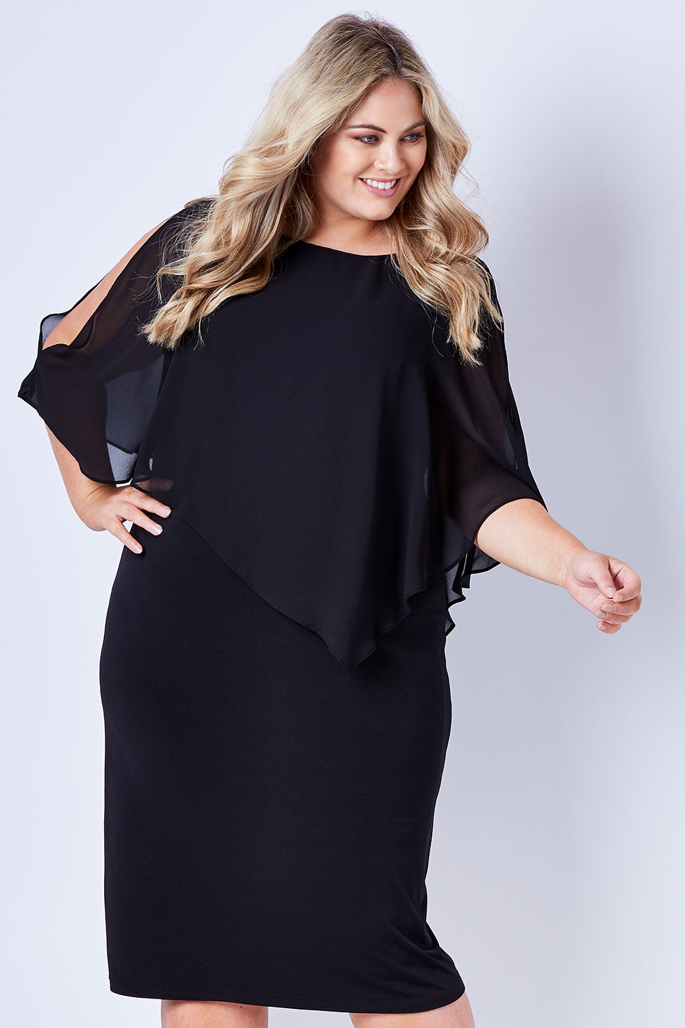 Model Sophie wearing size 20 of The Overlay Midi Dress in colour Black (Black), from the front, cropped image