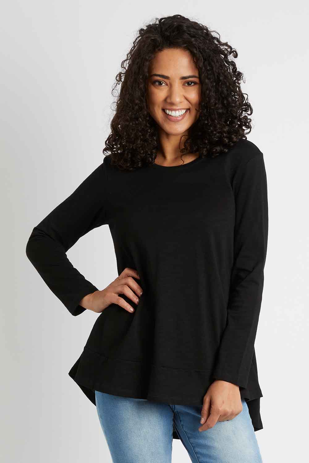 Model Pamela wearing size 10 of The Long Sleeve Swing Tee in colour Black (Black), from the front, cropped image