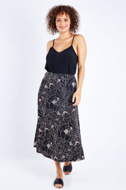 Model Lala wearing size 10 of The Pull On Skirt in colour Pinkfloral (Pink), from the front, showing the whole outfit