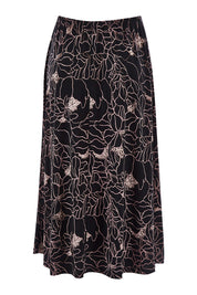 Product shot of The Pull On Skirt in colour Pinkfloral (Pink), from the back