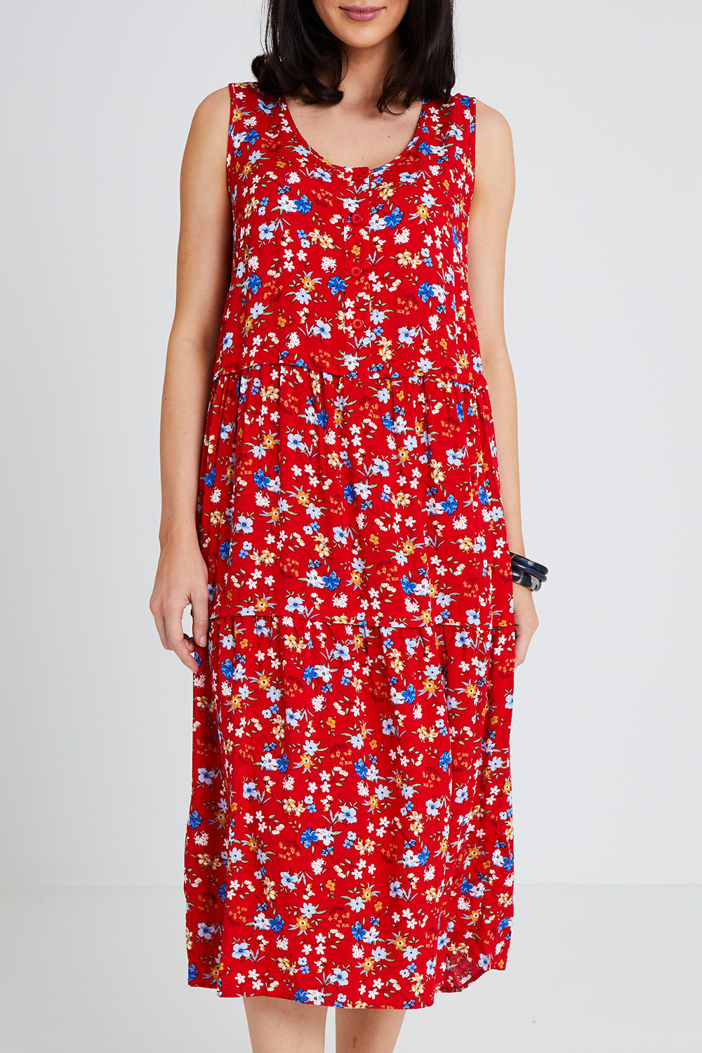 Model Andrea wearing size 10 of The Print Layered Maxi in colour Redfloral (Red), from the front, cropped image