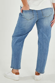 Model Maddy wearing size 16 of The Boyfriend Jean in colour Blue (Blue), from the back