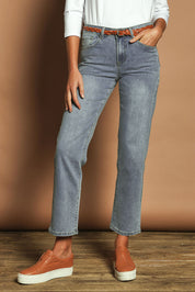 Model Madeline wearing size 10 of The Boyfriend Jean in colour Blue (Blue), from the front, cropped image