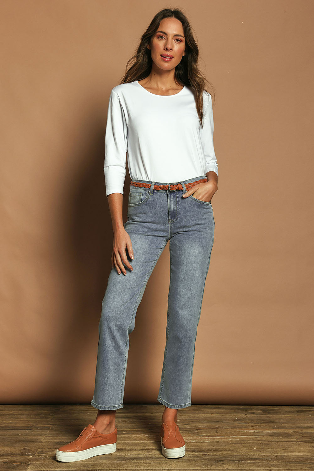 Model Madeline wearing size 10 of The Boyfriend Jean in colour Blue (Blue), from the front, showing the whole outfit