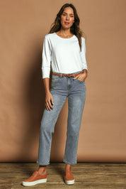 Model Madeline wearing size 10 of The Boyfriend Jean in colour Blue (Blue), from the front, showing the whole outfit