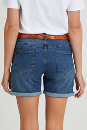 Model Madeline wearing size 10 of The 5 Pocket Denim Short in colour Dkdenim (Blue), from the back