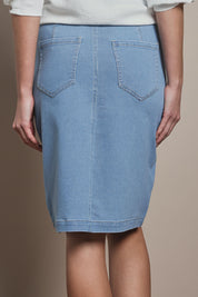 Model Madeline wearing size 10 of The Pull On Denim Skirt in colour Lightdenim (Blue), from the back