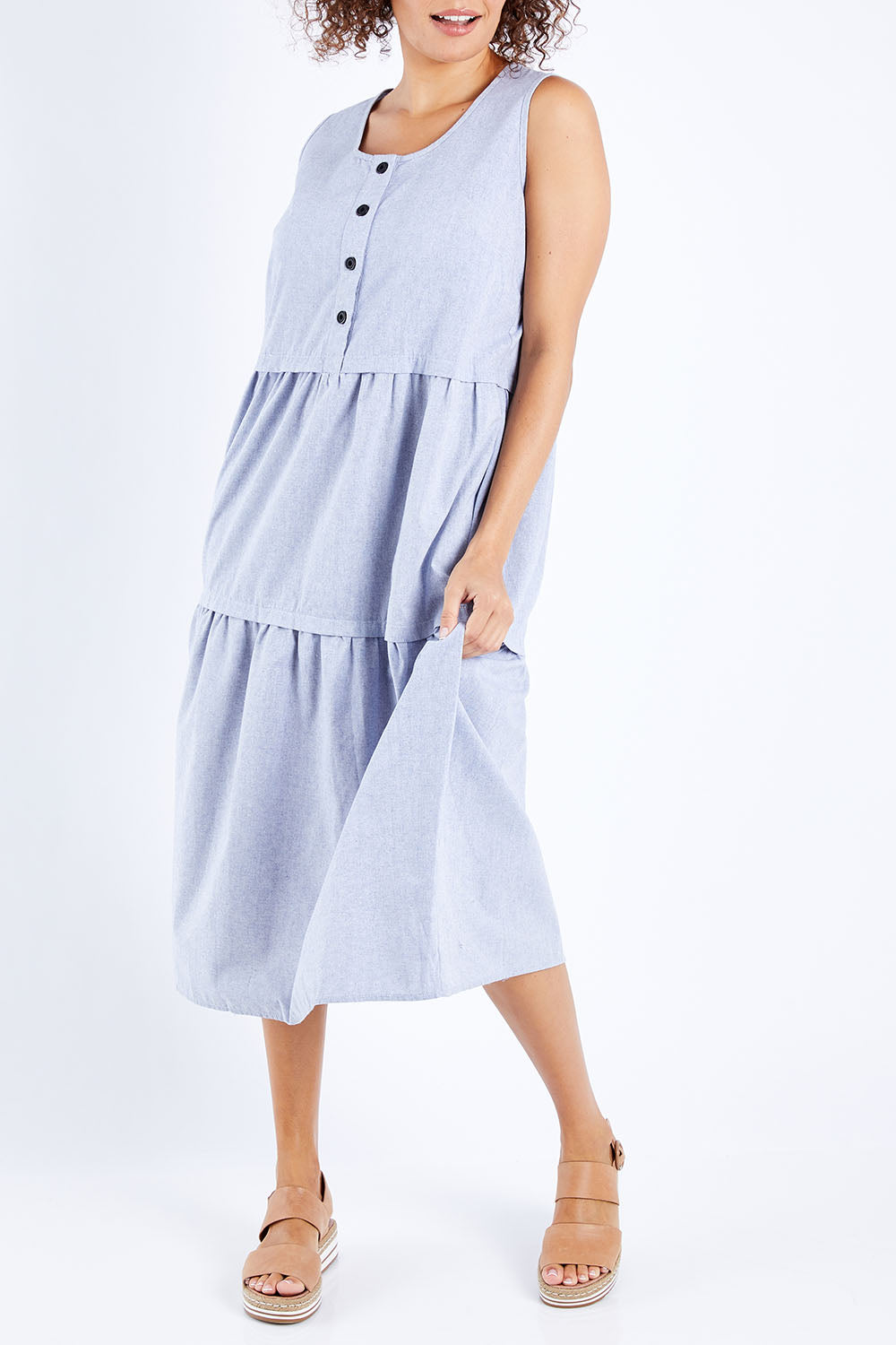 Model Lala wearing size 10 of The Chambray Tiered Dress in colour Chambray (Blue), from the front, cropped image