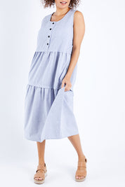 Model Lala wearing size 10 of The Chambray Tiered Dress in colour Chambray (Blue), from the front, cropped image