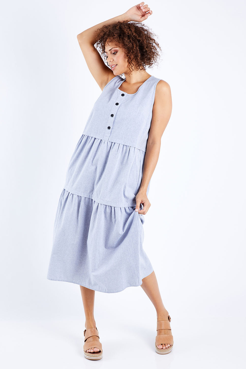 Model Lala wearing size 10 of The Chambray Tiered Dress in colour Chambray (Blue), from the front, showing the whole outfit