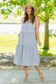 Model Laura wearing size 14 of The Chambray Tiered Dress in colour Chambray (Blue), from the front, showing the whole outfit
