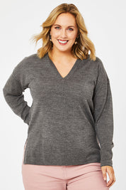 Model Jess wearing size L of The Hoody Knit Jumper in colour Charcoal (Grey), from the front, cropped image