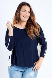 Model Laura wearing size L of The 2 Tone Jumper in colour Navy (Blue), from the front, cropped image