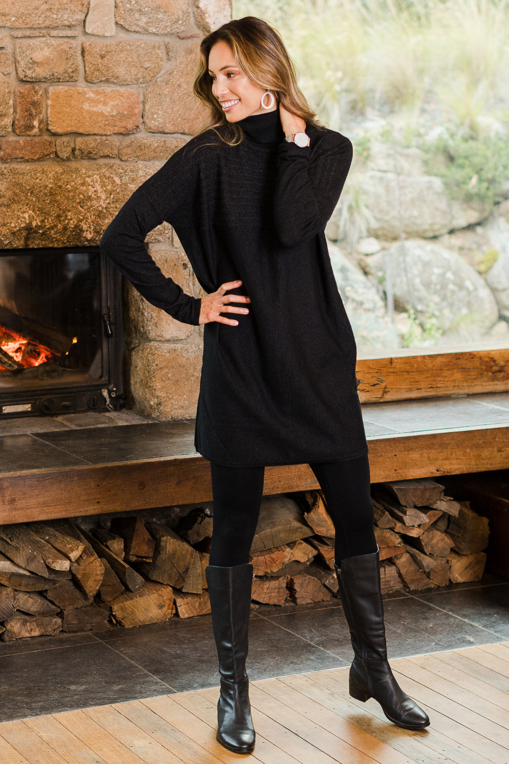 Model Amanda wearing size S of The Cable Knit Dress in colour Blackfleck (Black), from the front, showing the whole outfit