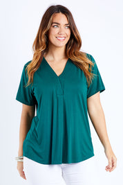 Model Laura wearing size 14 of The Stitch Detail Short Sleeve Top in colour Pinegreen (Green), from the front, cropped image