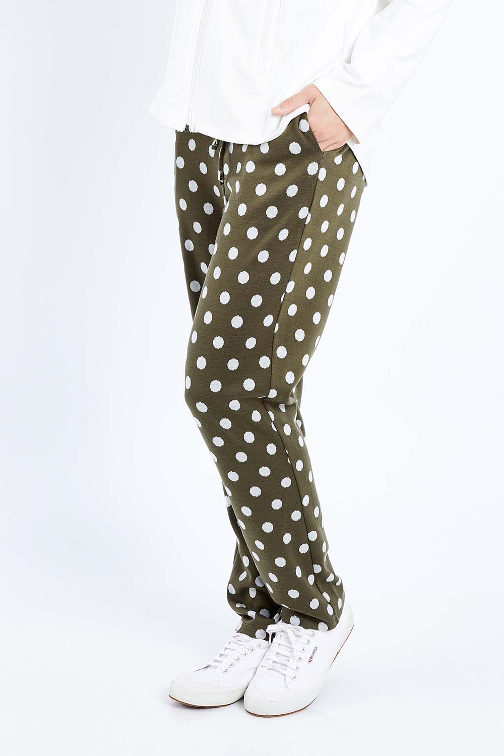 Model Andrea wearing size 10 of The Spot Jacquard Pull On Pant in colour Khakispot (Green), from the front, cropped image
