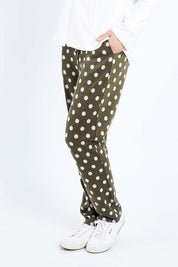 Model Andrea wearing size 10 of The Spot Jacquard Pull On Pant in colour Khakispot (Green), from the front, cropped image