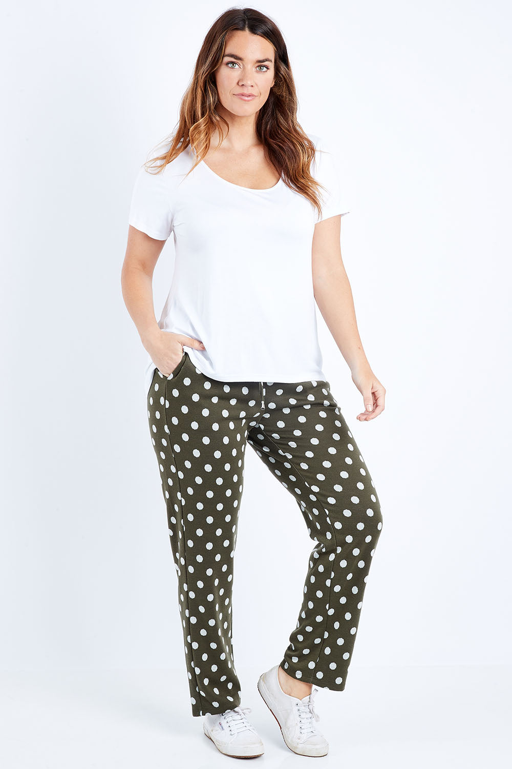 Model Laura wearing size 14 of The Spot Jacquard Pull On Pant in colour Khakispot (Green), from the front, showing the whole outfit