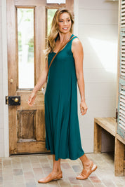 Model Amanda wearing size 10 of The Recycled A Line Midi Dress in colour Deeplagoon (Green), from the front, showing the whole outfit