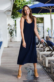 Model Amanda wearing size 10 of The Recycled A Line Midi Dress in colour Navy (Blue), from the front, showing the whole outfit