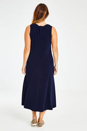 Model Laura wearing size 14 of The Recycled A Line Midi Dress in colour Navy (Blue), from the back