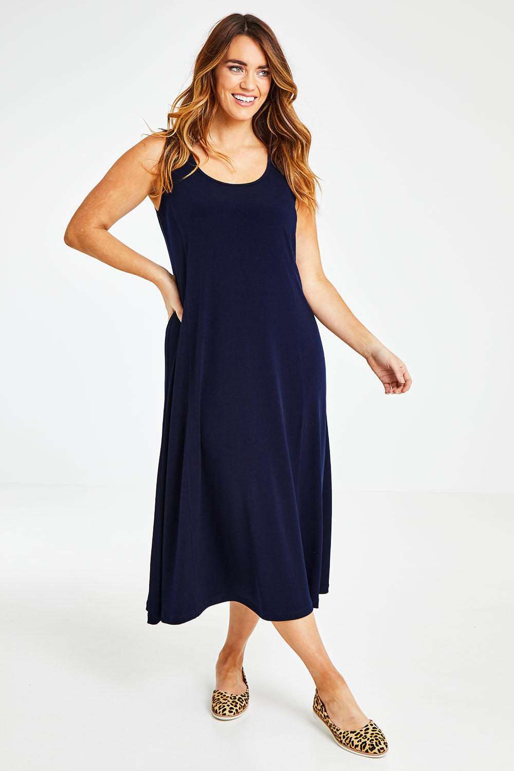 Model Laura wearing size 14 of The Recycled A Line Midi Dress in colour Navy (Blue), from the front, showing the whole outfit